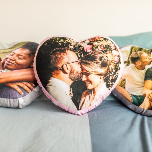 Personalized heart shaped cushion with a couple's photo on it
