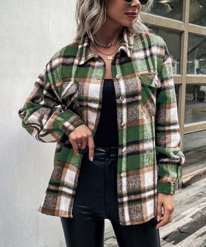Flannel shacket outfit for Christmas with green plaid shacket, black leather leggings, and black top