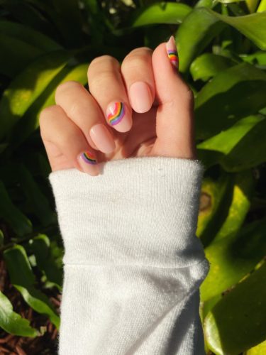 Nude nails with rainbow nail art