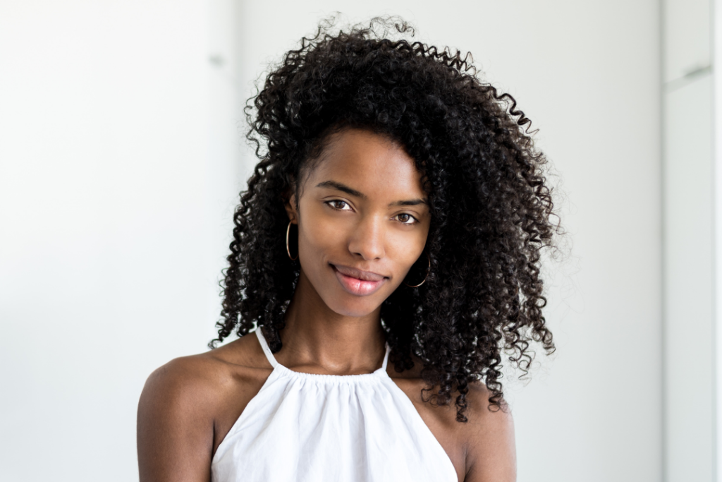 Woman with shoulder length naturally curly hair