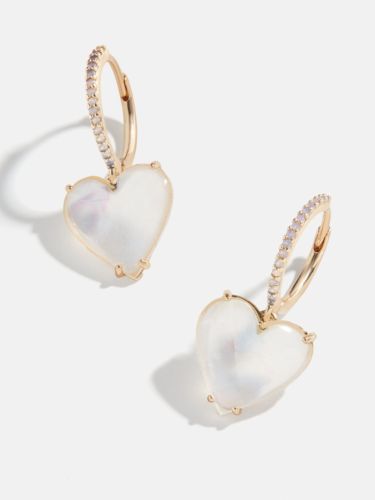 Pretty Valentine's day earrings with heart shaped white opal stone dangling from gold pave huggie hoops