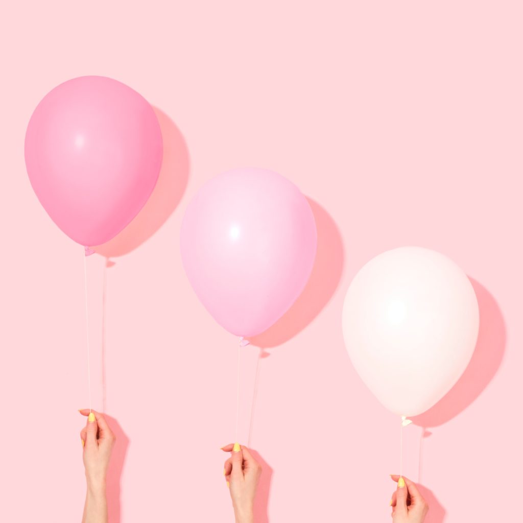 Photo of pink balloons on a pink background