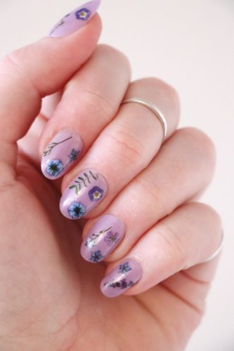 Blue and purple flower nail design