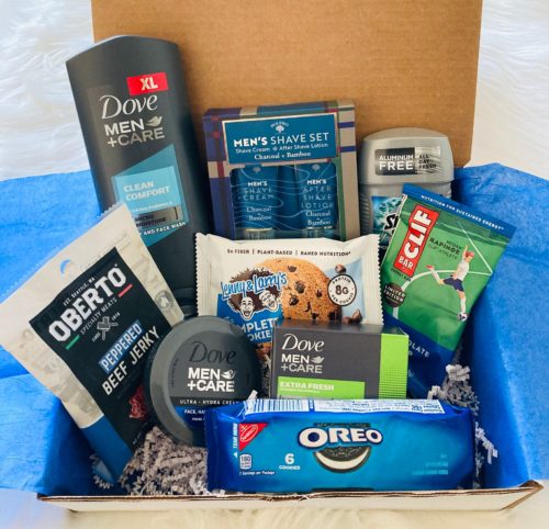 Mens care package with deodorant, beef jerky, soap, shaving supplies, and more