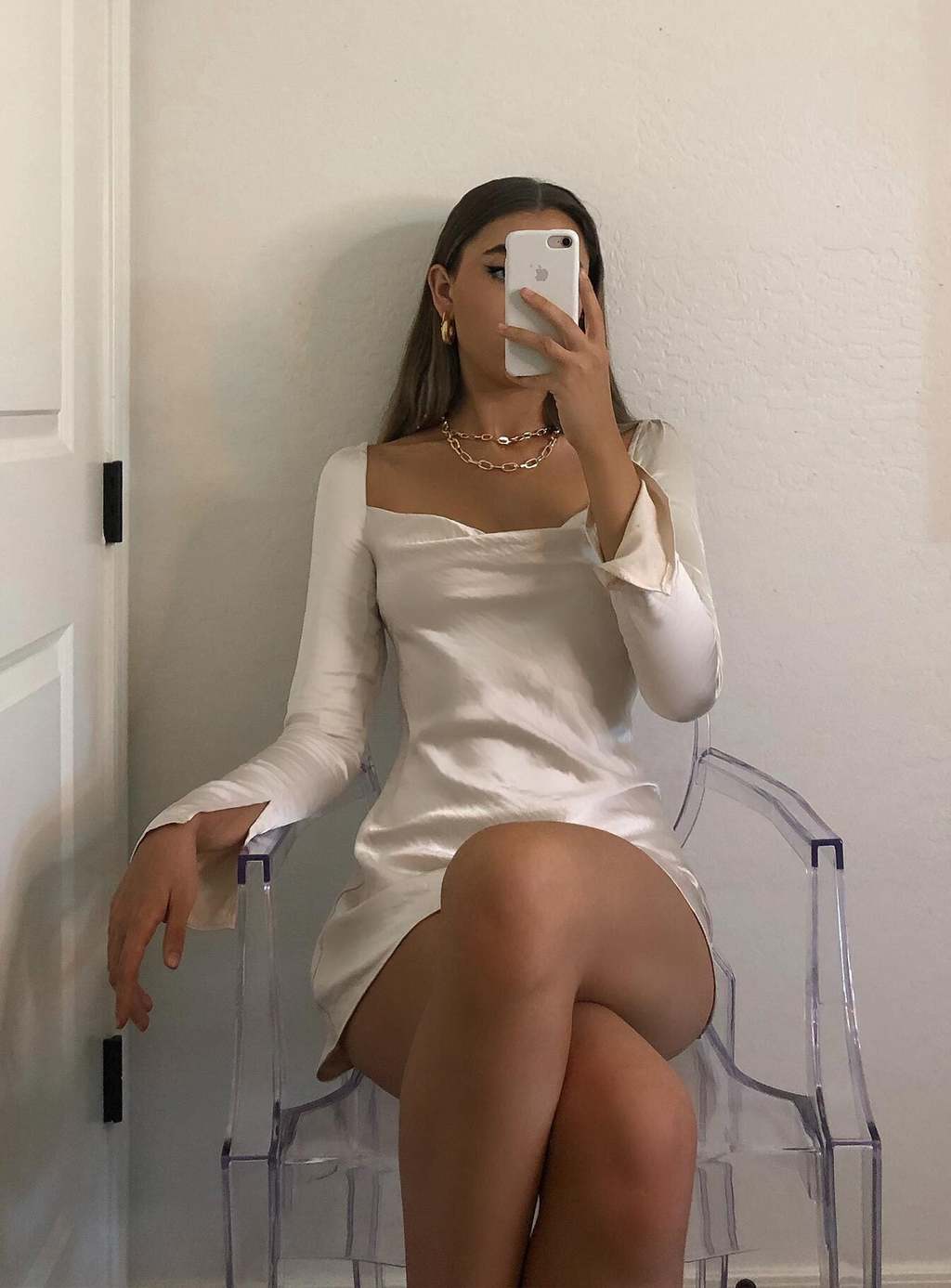 A woman sitting in a chair in her Cocktail Theme Party outfit