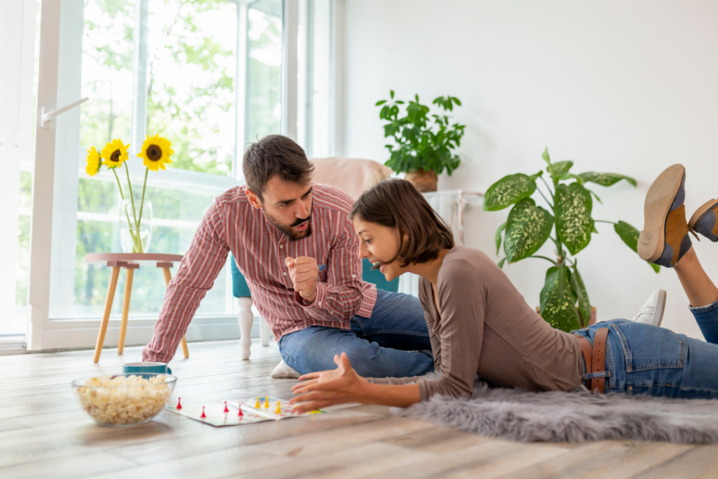 Couple playing a board game together