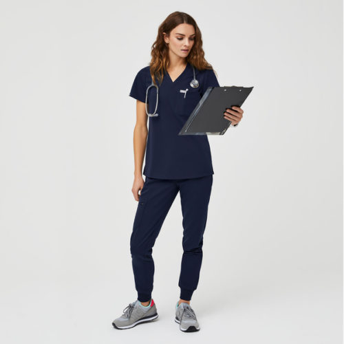Photo of a woman wearing FIGs short sleeve tee and jogger scrubs