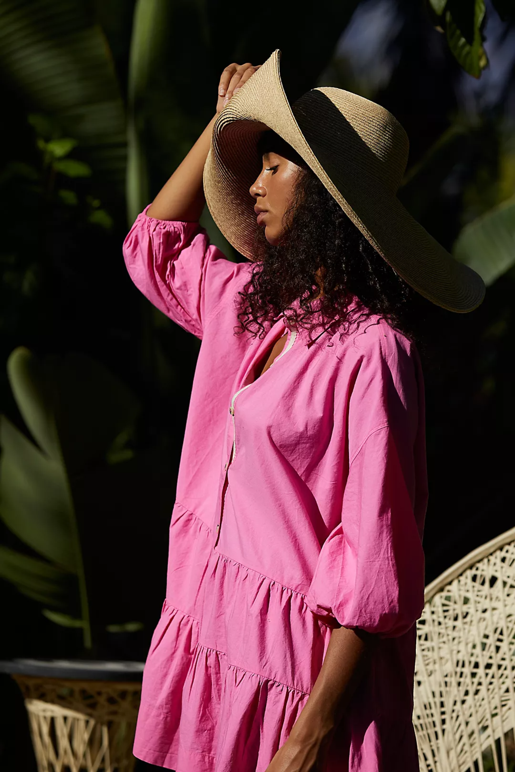 A woman in her Floppy Hat with Mini Dress