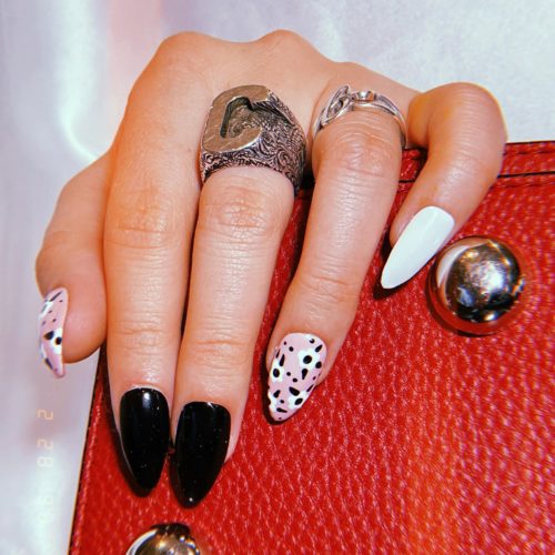 Pink nails with black and white flowers