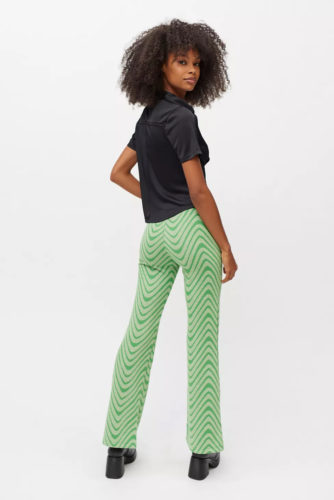 UO Green Printed Pants with black short-sleeve top and black ankle boots
