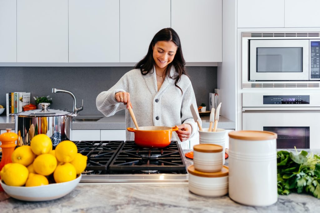 Photo of a woman cooking from unsplash