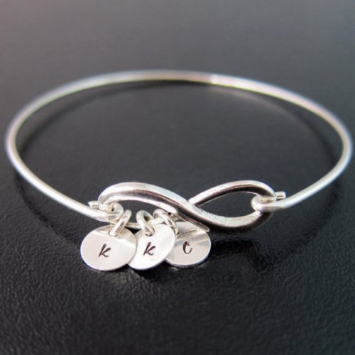 Mini infinity BFF bracelet from Etsy in silver with three charms reading K K C