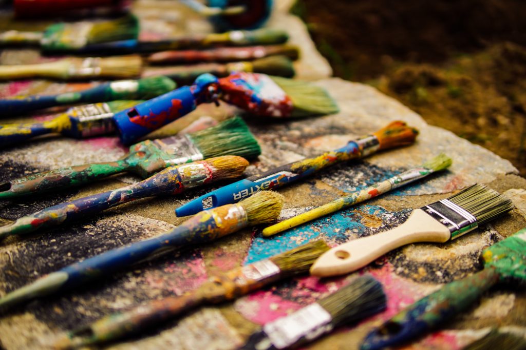 photo of paintbrushes from unsplash - summer bucket list ideas