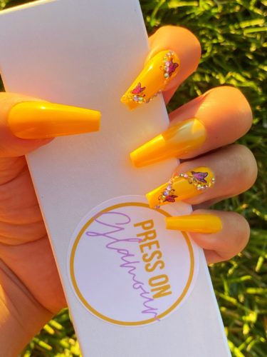 Yellow butterfly nails with rhinestones