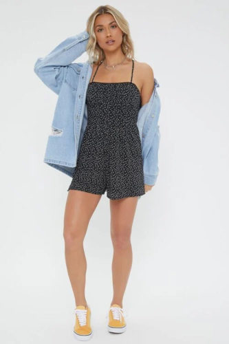 Forever 21 Romper in black ditsy floral print with oversized denim jacket and yellow canvas sneakers