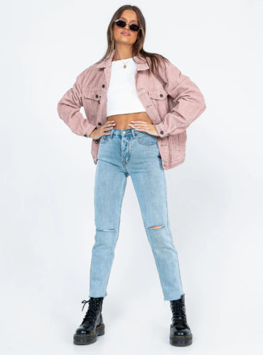 Princess Polly Corduroy Jacket in pink paired with white crop top, blue high waisted jeans, and black combat boots