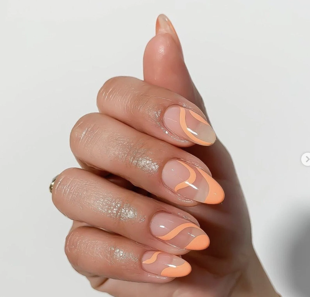 Almond french tip abstract nails in peachy orange