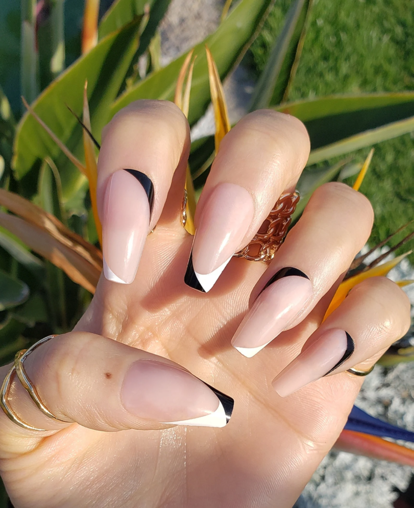 Nude nails with black and white abstract french tips