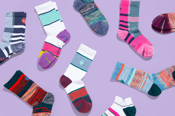 Header graphic with a bunch of cute and colorful socks on a purple background
