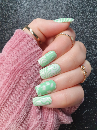 Euphoria inspired nails based on the character Maddy's mod green and white pastel nails