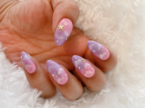 Pink and purple glitter cloud ombre nails with rhinestone detailing