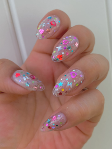 Holographic confetti nails with butterflies, hearts, and stars