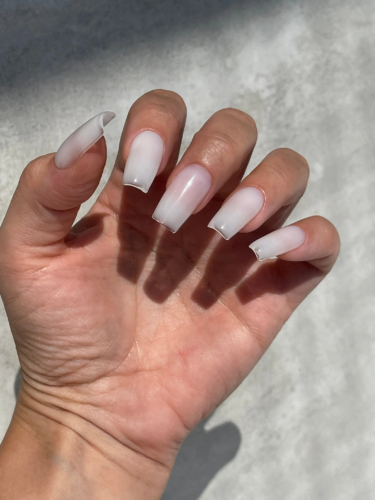 Milky gel manicure on coffin shaped nails