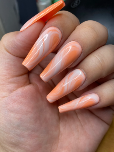 Bright orange creamsicle swirl nails