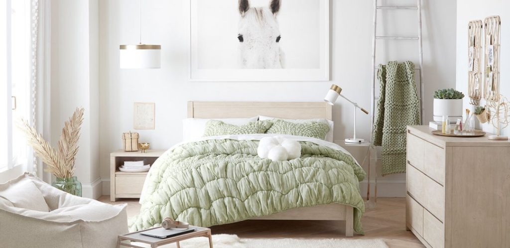 Pastel green and white room from PBTeen with light wood furniture