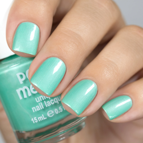 Pearlescent mint nail polish on short square nails