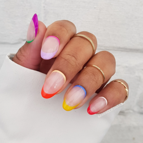 Rainbow french nails in a rounded shape