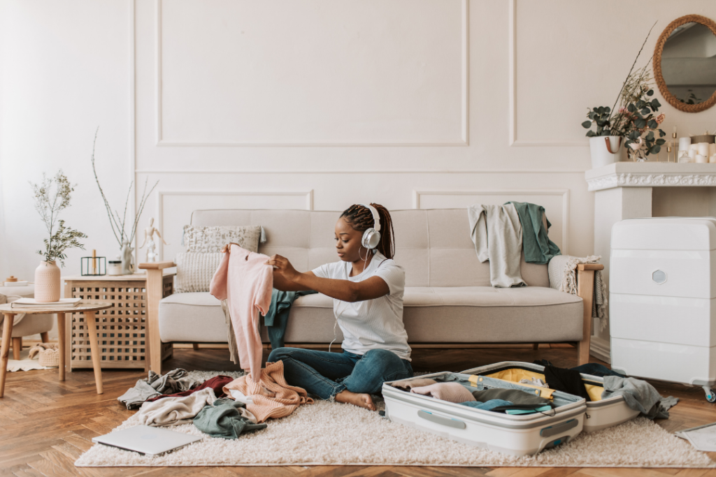 Woman packing clothes in a suitcase