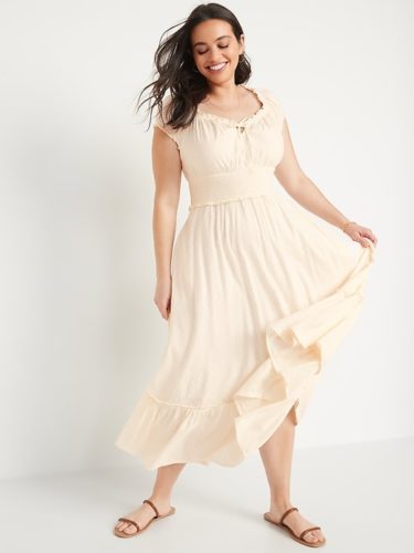 A cream puff sleeve midi dress and brown gladiator sandals.