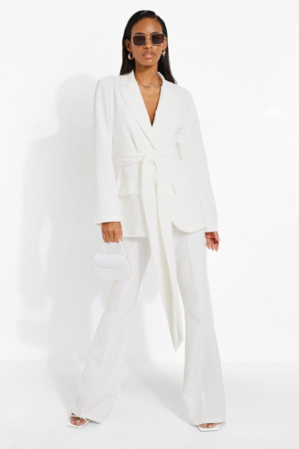 White wrap belted suit with white heels