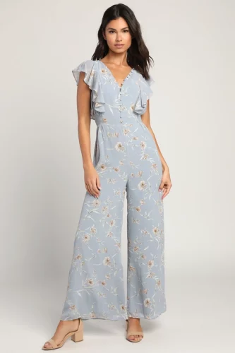 A blue floral jumpsuit and tan strap heels.