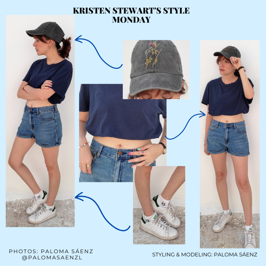 Summer outfit inspired by Kristen Stewart's style with white sneakers, denim shorts, cropped navy blue tee, and graphic baseball hat