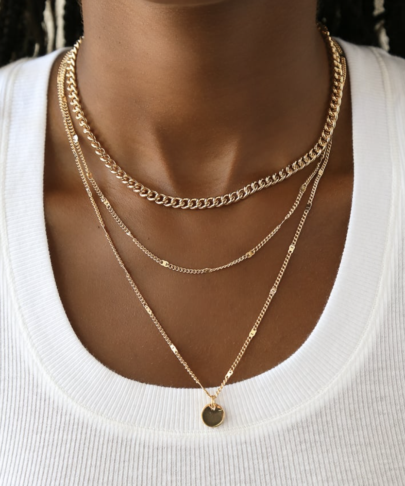 Layered gold necklaces