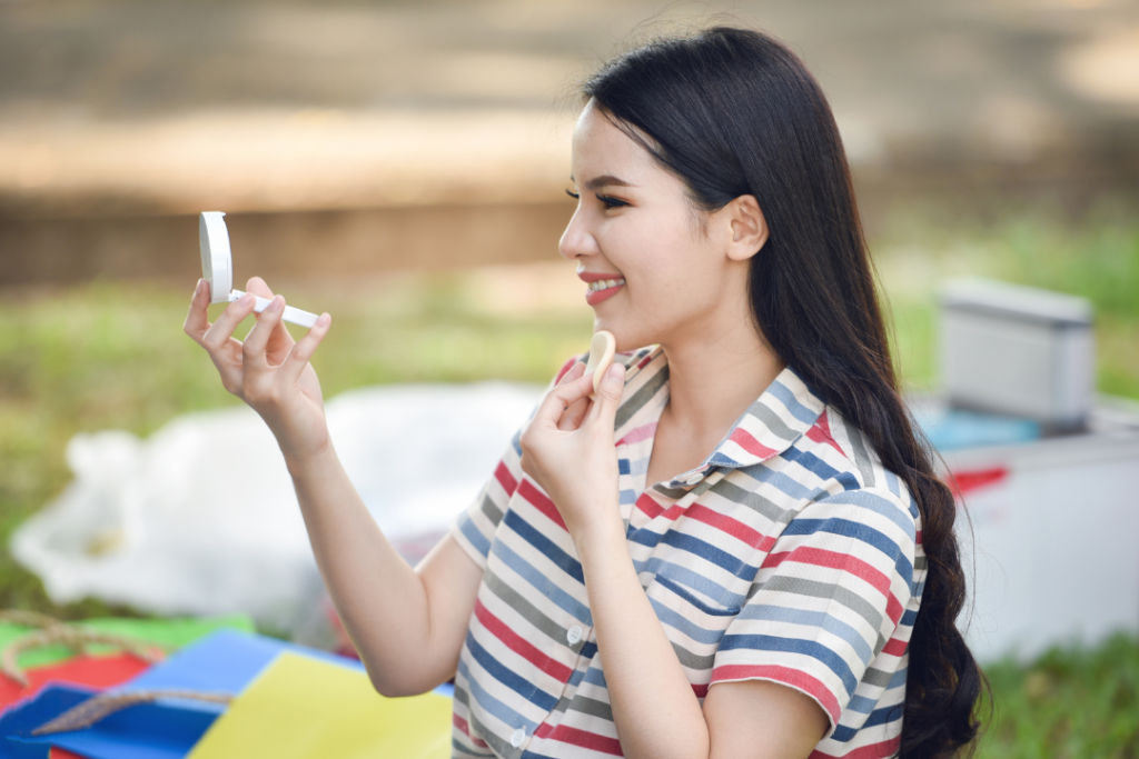 Woman using a Korean cushion foundation