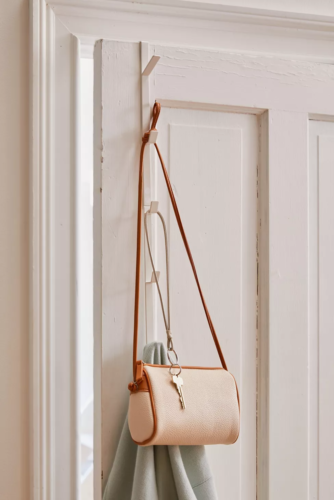 Dorm organization tips: Use an over the door hanger for purses | Photo of over the door hook from Urban Outfitters