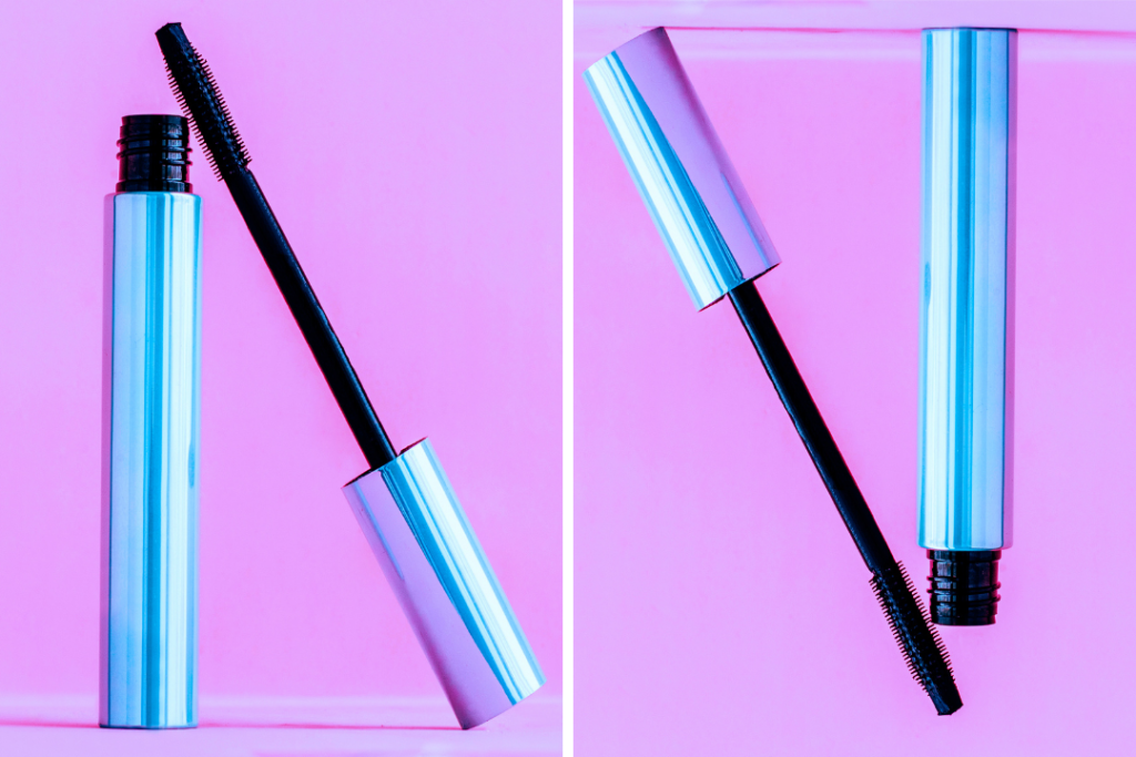 Photo of a blue tube of mascara on a hot pink background