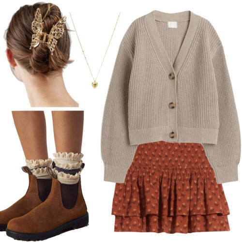 Cottagecore Outfit with a ruffled tiered mini skirt, taupe cardigan sweater, gold heart pendant necklace, butterfly hair clip and ruffle socks with Chelsea boots