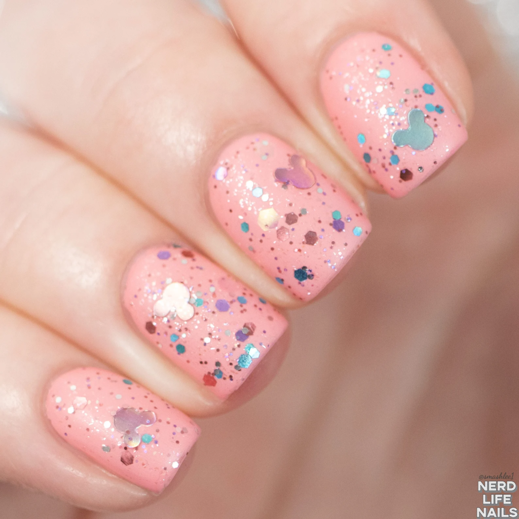 Pink nails with mickey mouse shaped glitter