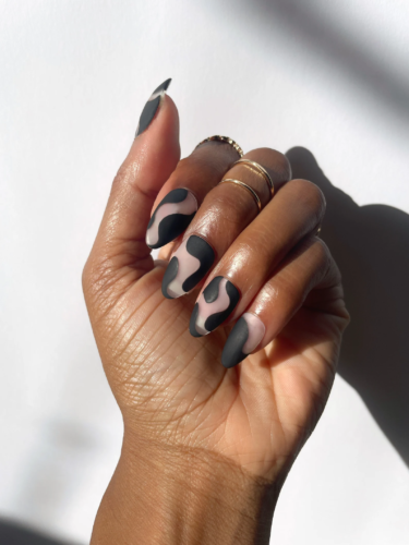 Matte black swirls done on clear nails