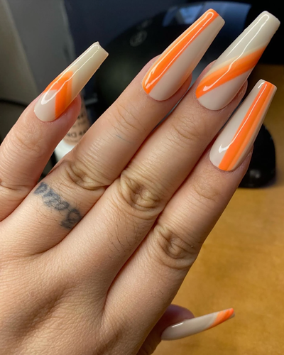 Pumpkin spice long coffin shaped nails with orange stripes