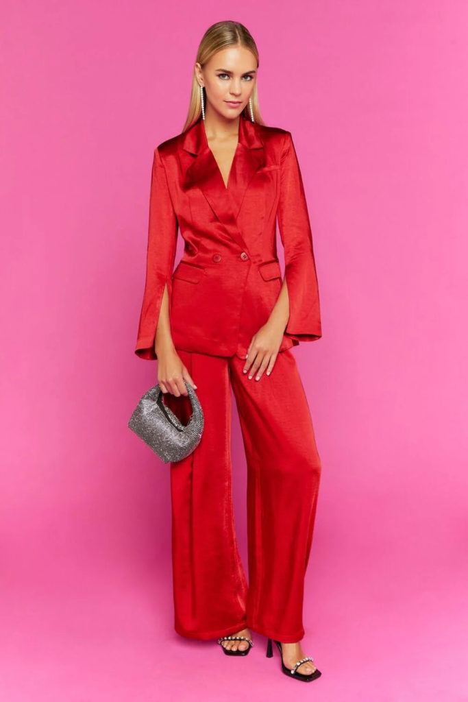 If you dress up for Christmas in this red satin suit with wide-leg pants and a split-sleeve blazer, you'll definitely be the most fashionable person there. Make sure to accessorize with shoes and a striking bag.