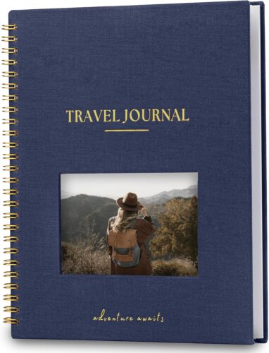 Personalized travel journal for couples with a navy fabric cover and the text Travel Journal on the cover, along with a space for the couple's photo