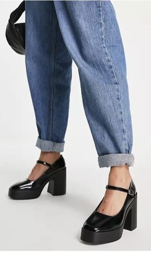 An outfit with jeans and black patent heel mary janes.