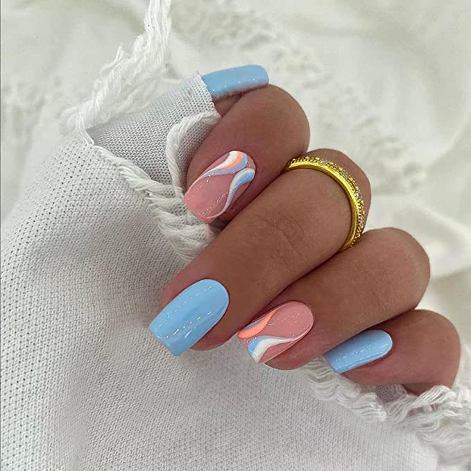 Gel nail design from Amazon in pink and blue swirl
