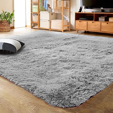 gray large fuzzy rug in room
