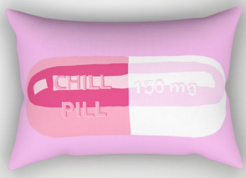 rectangle stiff pink pillow with a pill that says chill pill 150mg